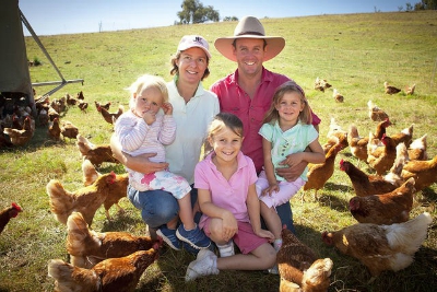 Capital Region Farmers Market Stallholder , Holbrook Paddock Eggs owners with their children and chickens