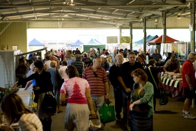 Visitors and shoppes at the Capital Region Farmers Market